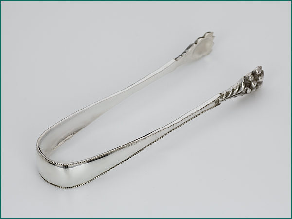 Zilveren (ijs)klontjestang uit 1886-0